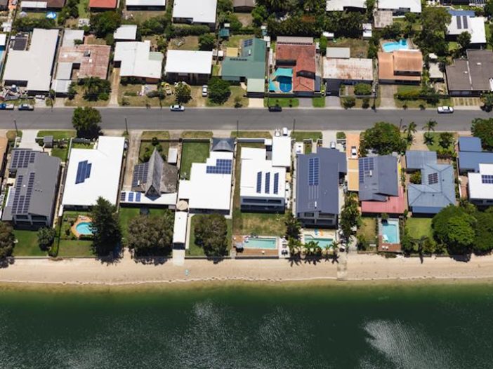 Solar panels on suburban waterfront homes, Australia