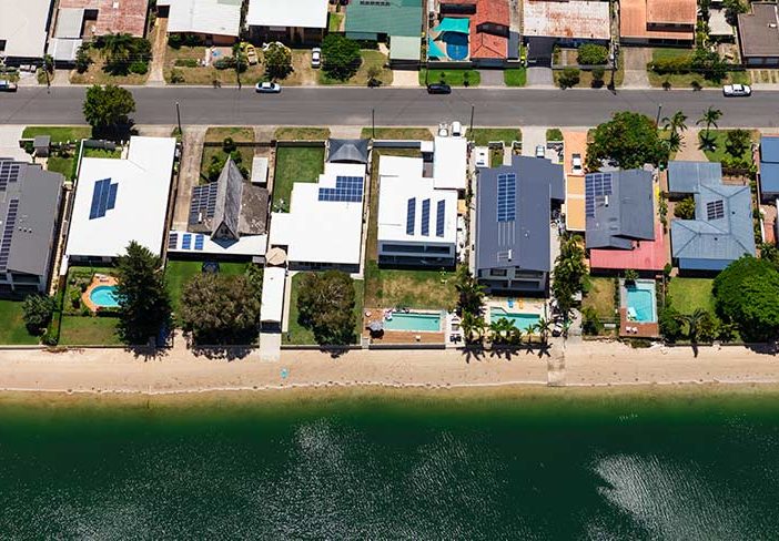 Solar Panels on Suburban Waterfront Homes power ledger - optimised