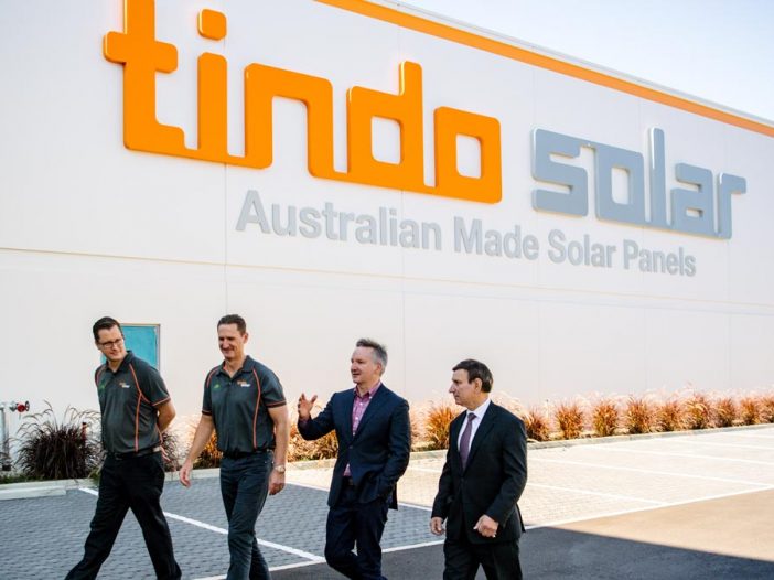 Tindo Solar GM Robert Sporne, CEO Shayne Jaenisch, Shadow Minister for Climate Change and Energy Chris Bowen and Member for Makin Tony Zappia outside Tindo Solar in Adelaide. (AAP Image/Morgan Sette).