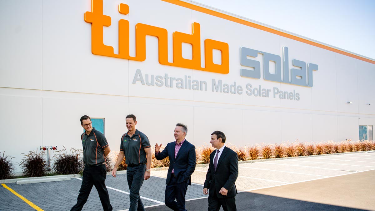 Tindo Solar GM Robert Sporne, CEO Shayne Jaenisch, Shadow Minister for Climate Change and Energy Chris Bowen and Member for Makin Tony Zappia outside Tindo Solar in Adelaide. (AAP Image/Morgan Sette).